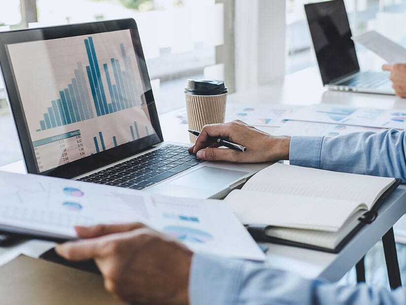 closeup businessman looking at laptop charts