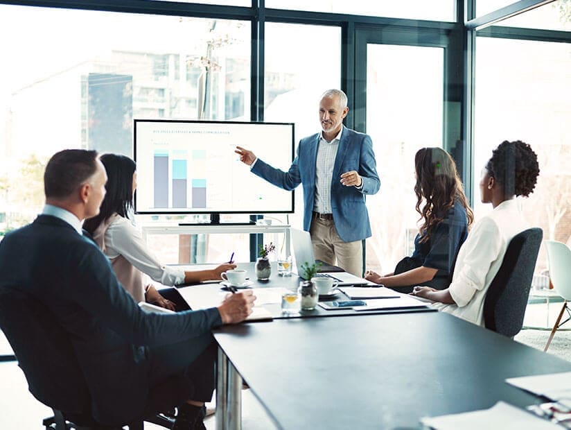 man presenting growth data in conference room