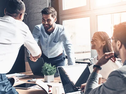 Fractional CFO and Strategic Advisory Services | Paro.ai 28 Two-men-shake-hands-during-finance-meeting