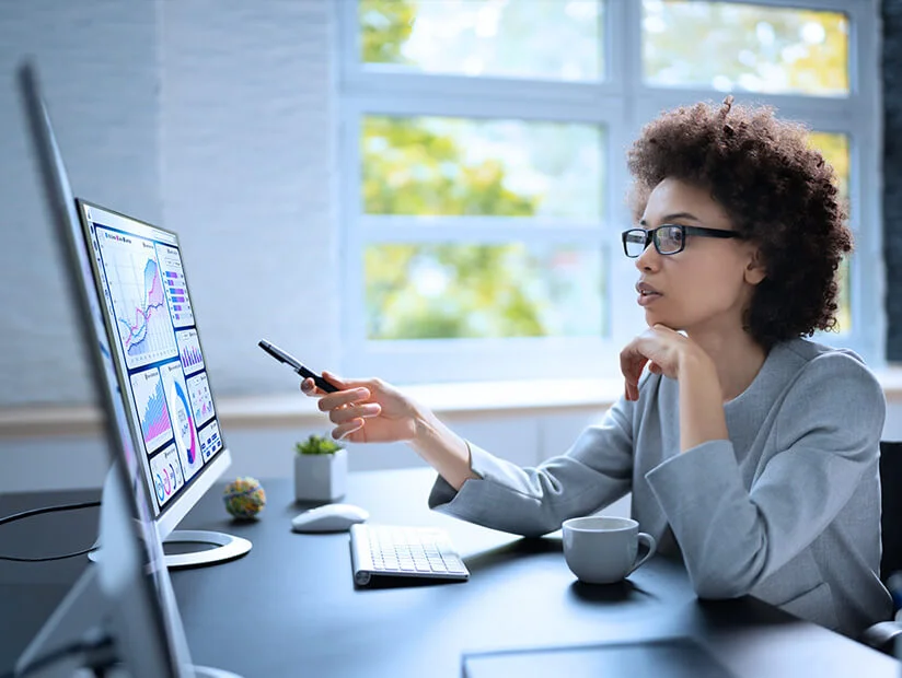Financial Planning & Analysis (FP&A) Services 12 Woman-at-computer-reviews-budget-documents