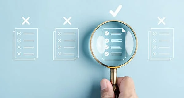 CFO Hub 12 concept with hand holding magnifying glass over compliant document 1