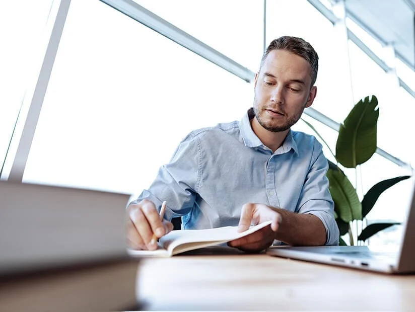 Business Tax Preparation Services 3 man-reviews-business-tax-filings