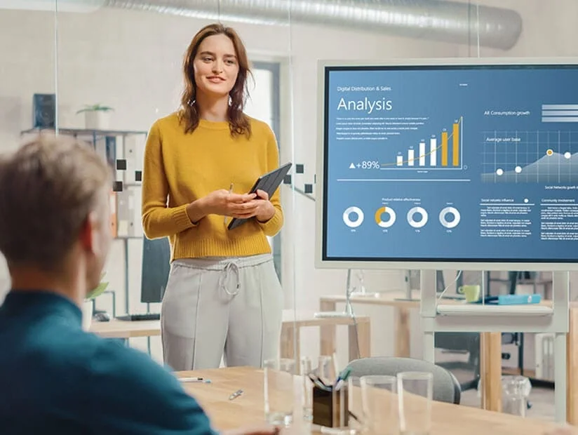 Data Visualization Consulting Services 6 Professional-woman-presenting-business-intelligence-data analysis