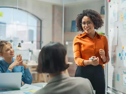 Tech and AI Consulting Services 26 woman executive presenting growth plan 1 cropped