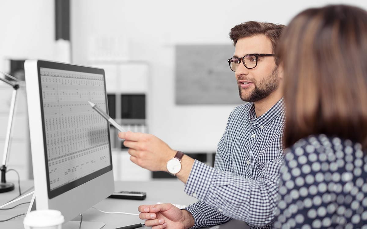 two people discussing a financial forecast